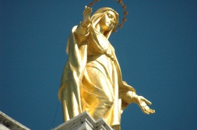 Sculpture of Virgin atop Saint Mary of the Angels below Assisi